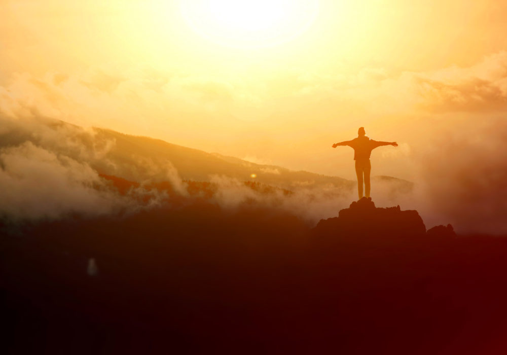 Tourism in mountains. Tourists on the top of the mountain. Nature in mountains at autumn.